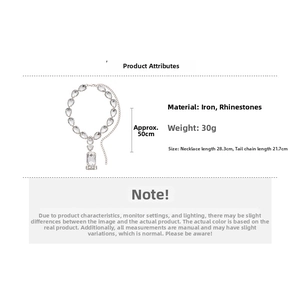 Silver tone choker necklace featuring teardrop rhinestones and large rectangular pendant