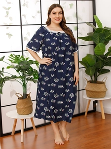 Detail of floral print plus size sleepwear showing lace neckline and bow detail
