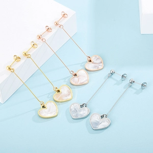 Three pairs of elegant long heart drop earrings in gold, silver, and rose gold finishes