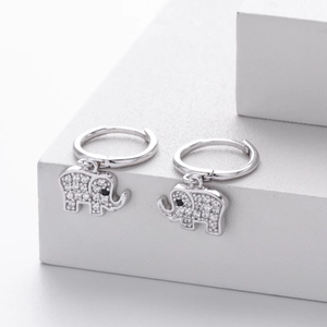 Macro shot of 925 sterling silver elephant drop earrings with pavé cubic zirconia