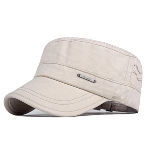 Detail of beige canvas cadet cap showing metal plate and side wavy stitching