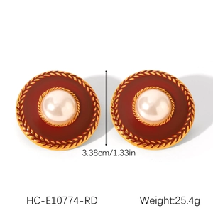 Detail view of retro red enamel earrings with white pearls and gold trim, 3.38cm size