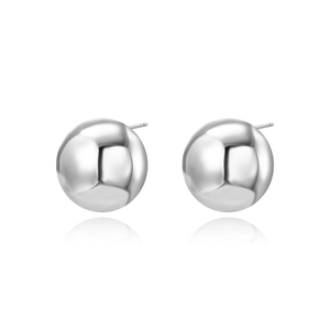 Detailed view of polished silver sphere stud earrings with reflection on white background