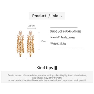 Detail view showing dimensions and materials of long pearl tassel flower earrings