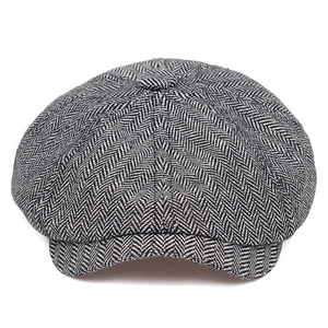 Classic herringbone newsboy cap in black and white wool blend for a vintage look