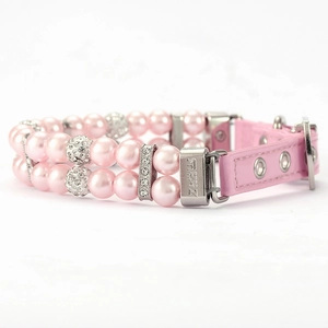 Detailed macro view of pink pearl pet collar with crystal balls and adjustable strap