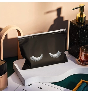 Close-up of black eyelash pattern zipper bag on a display stand for makeup storage