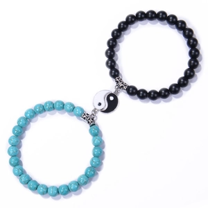 Detail of 8mm couple bracelets with black matte beads and Yin Yang Tai Chi charm