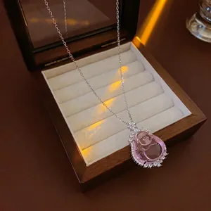 Pink resin Buddha pendant necklace with zircon halo and silver chain in a luxury box
