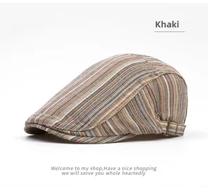 Detail of khaki striped flat cap featuring vintage side metal buckle and woven texture