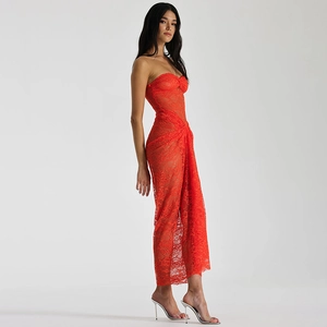 Macro detail of the red lace texture and mesh stitching on the slim fit tube maxi dress