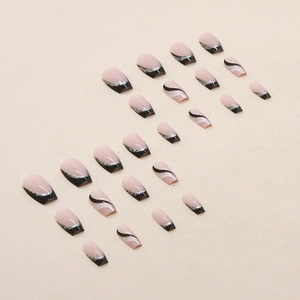 Short ballet false nails in nude pink with black French tips and silver glitter stripes