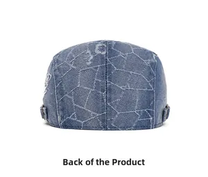Rear view of washed denim flat cap with white geometric stitching and metal buckle