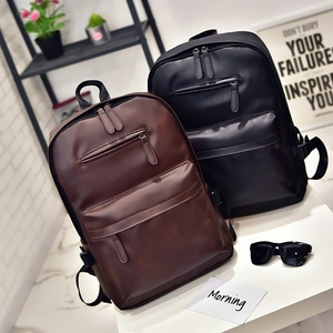 Minimalist PU leather backpacks for men in black and brown displayed on white surface