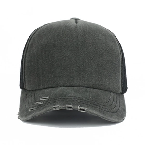 Front detail of charcoal grey washed cotton baseball cap with distressed brim and mesh back