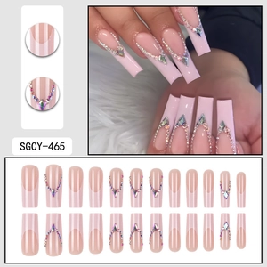 Long coffin light pink French press-on nails with rhinestones and diamonds set