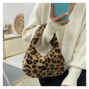 Close-up of leopard print plush handbag showing soft faux fur texture for autumn style