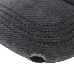 Close-up of distressed brim details and parallel stitching on washed cotton baseball cap