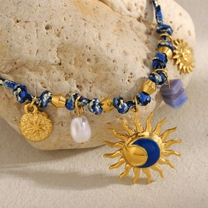 18K gold plated necklace with sun moon enamel pendant and woven rope strap
