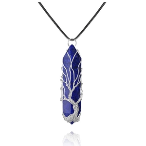 Macro shot of Lapis Lazuli hexagonal pendant with silver wire Tree of Life wrapping