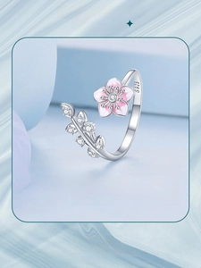 Macro detail of S925 sterling silver cherry blossom open ring with pink enamel and zircons