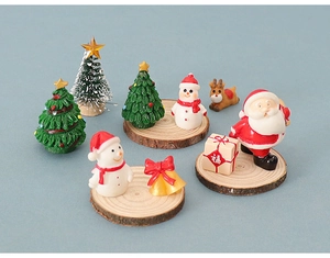 Miniature Christmas set with Santa, snowmen and reindeer on wooden bases