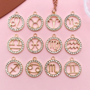 Detailed 12 Zodiac signs alloy charms set with white rhinestones in rose gold finish