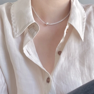 Close-up of a 925 sterling silver bead choker necklace worn on a woman's neck