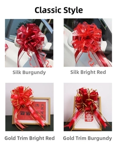 Detail of red wedding car mirror bows with gold trim and silk texture ribbons