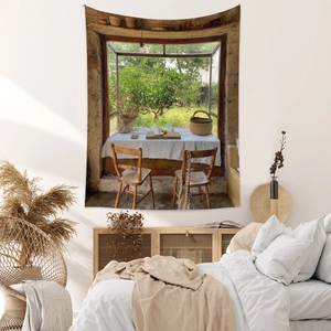 Scenic window view tapestry showing a cozy country scene with fruit trees and rustic table