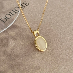 Minimalist 925 sterling silver gold oval pendant necklace with a white gemstone