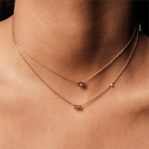 Layered gold stainless steel necklaces featuring angel number 333 pendant and crystals