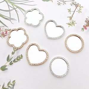 Sparkling rhinestone-encrusted small mirrors in heart and flower shapes for DIY decor