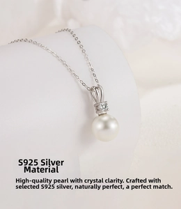 Detailed close-up of S925 sterling silver V-shape necklace with round white natural pearl