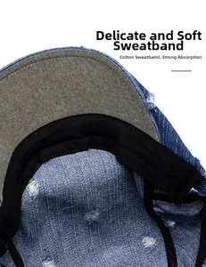 Detail of washed denim beret featuring soft cotton sweatband and vintage distressed edges