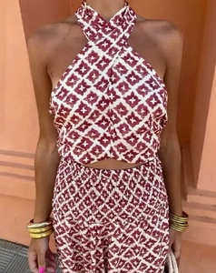 Detail of burgundy geometric print halter crop top and high waist matching skirt set