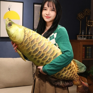 Detailed view of large golden fish plush pillow shell with realistic scale patterns