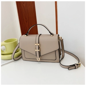 Detail view of khaki PU leather crossbody bag with adjustable strap and golden hardware