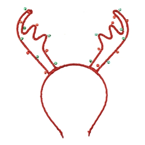 Macro detail of red glitter reindeer antler headband with festive green and red bells