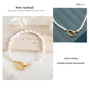 Close-up of elegant freshwater pearl jewelry with a unique gold irregular metal clasp