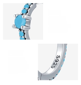 Close-up of S925 sterling silver earring with turquoise inlay and visible hallmark
