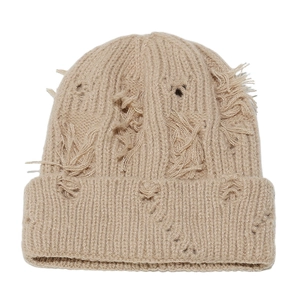 Distressed knit beanie in warm beige with aesthetic ripped holes and ribbed texture