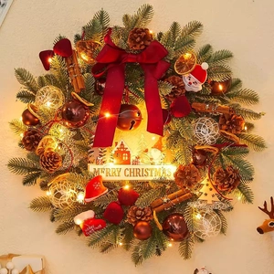 Christmas wreath with pine cones, red bow, and LED lights for festive door decoration
