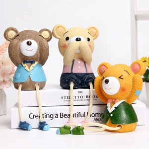Three creative resin bears in hear-see-speak no evil poses with hanging rope legs