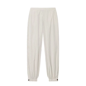 Women's plaid nylon jogger pants with elastic waist and buttoned ankle details