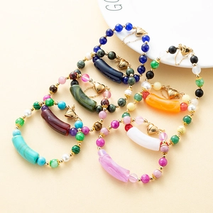 Handmade natural stone beaded bracelets with gold heart charms in multiple vibrant colors