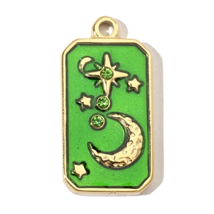 Detail of a rectangular green enamel pendant with gold star and moon patterns
