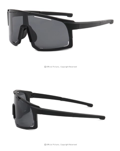 Detail view of professional cycling sunglasses with matte black frame and grey lenses