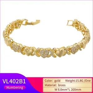 XOXO gold brass bracelet featuring heart and X patterns with white cubic zirconia stones