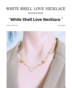 Close-up of white shell heart necklace in titanium steel with zircon barrel accents